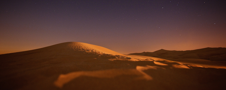Photograph of the desert at sunset.