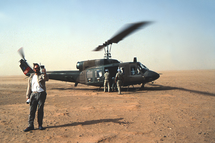 Photograph of Ron Blom and group at a dig site.