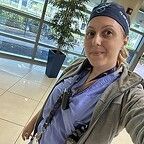 Selfie of a woman standing in a lobby