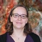 Portrait photo of a smiling woman wearing glasses