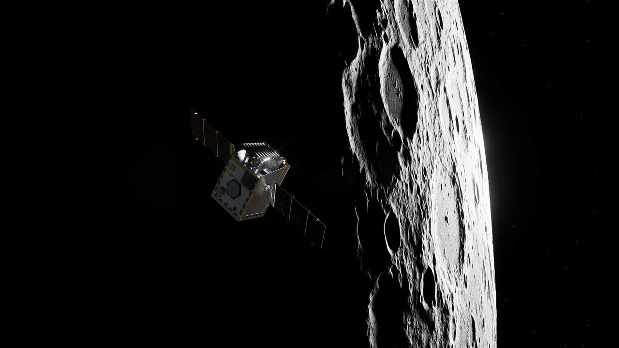 A silver spacecraft with its solar wings extended in front of a partially lit Moon.