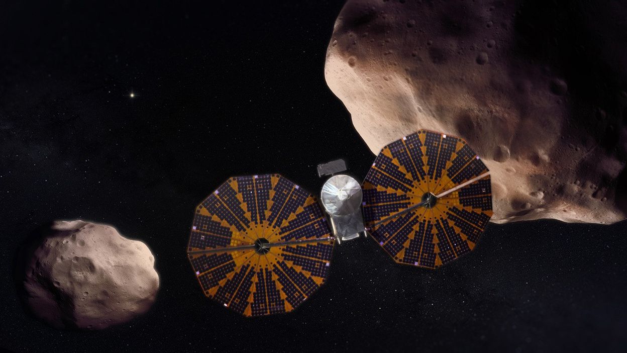 Artist's concept of the Lucy spacecraft flying by two of its asteroid targets.